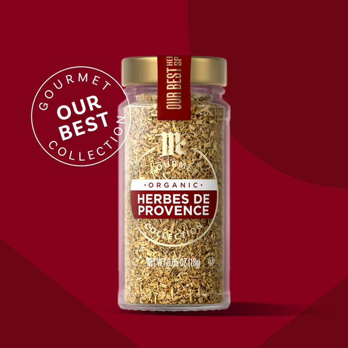 A jar of Herbes de Provence from the Gourmet Our Best Collection is displayed against a red background.