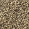 A close-up texture of coarse, dark sand.