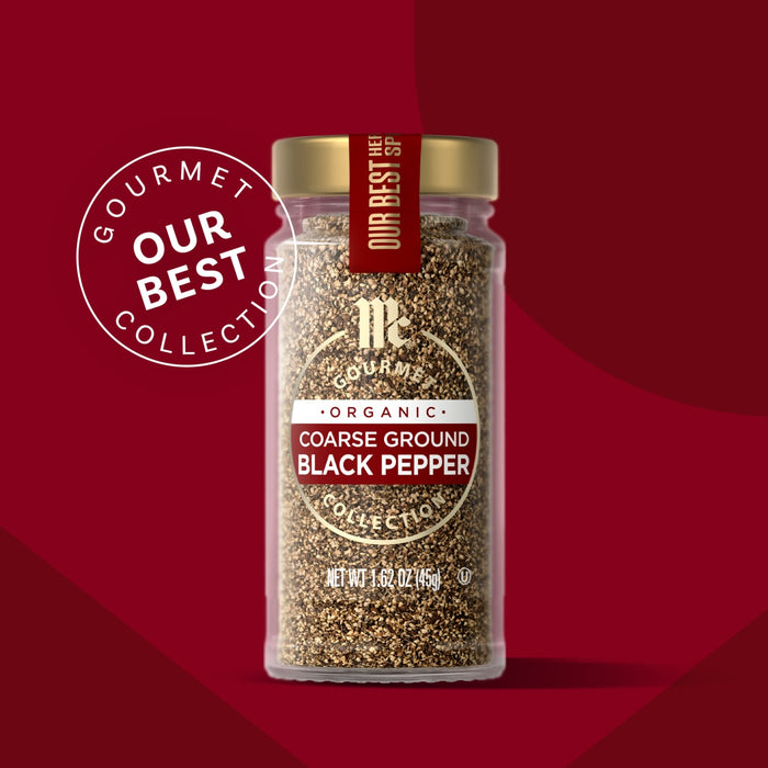 McCormick Gourmet Collection Coarse Ground Black Pepper in a glass jar with a gold lid and a red label.