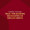 The image highlights the coarse texture of a product, emphasizing its suitability for rubbing on roasted or grilled meats.