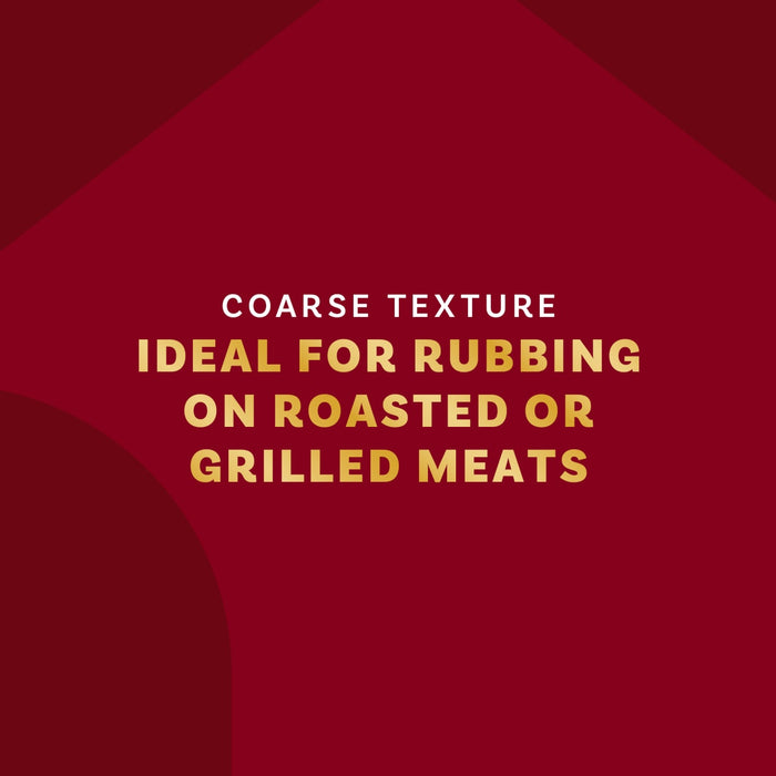 The image highlights the coarse texture of a product, emphasizing its suitability for rubbing on roasted or grilled meats.