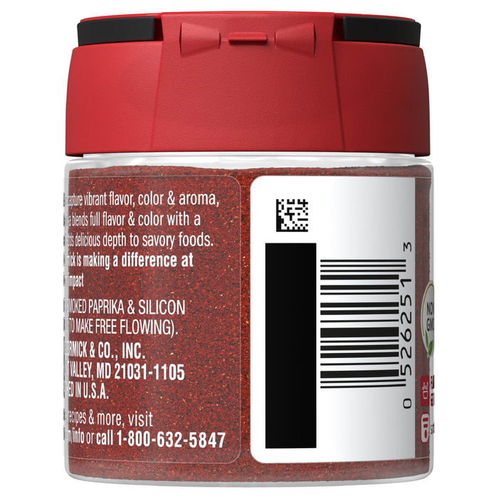 A glass jar of McCormick Smoked Paprika with a red lid and a white label with product information.