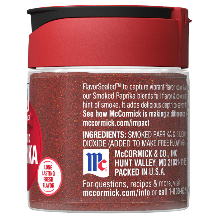 A glass jar of McCormick Smoked Paprika with a red lid.