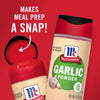 A red container of McCormick Garlic Powder with the lid open and an arrow pointing to the inside.