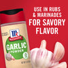 A jar of McCormick Garlic Powder with fresh garlic cloves.
