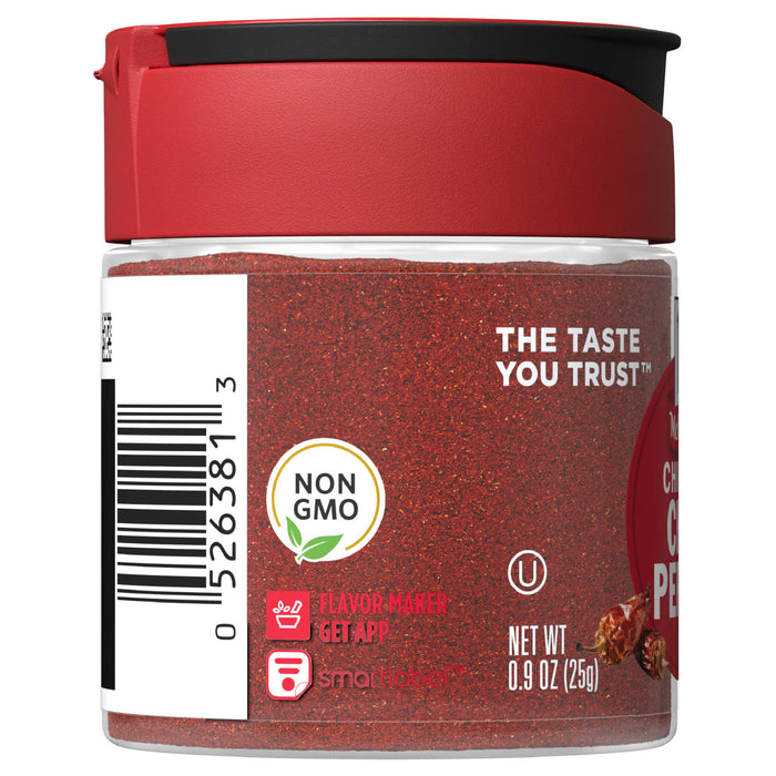 A jar of McCormick Crushed Red Pepper, a non-GMO product.