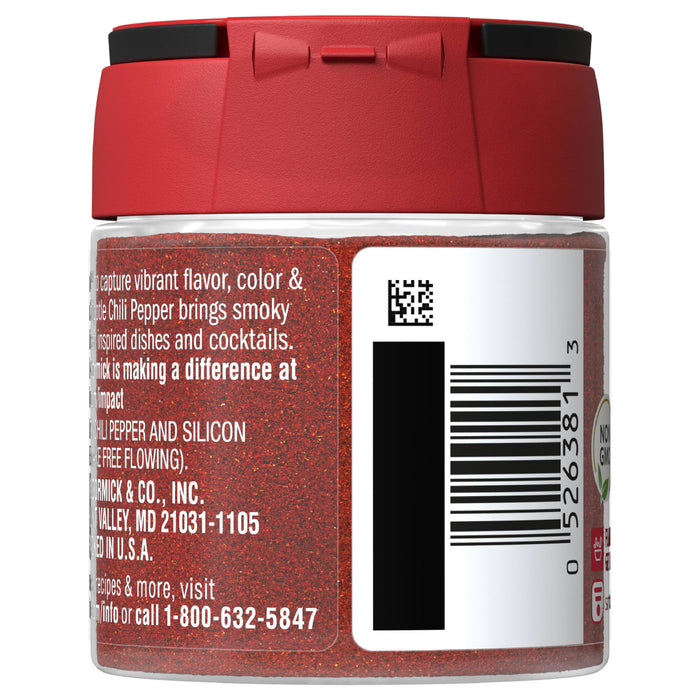 A red jar of McCormick Chili Pepper with a white label and barcode.