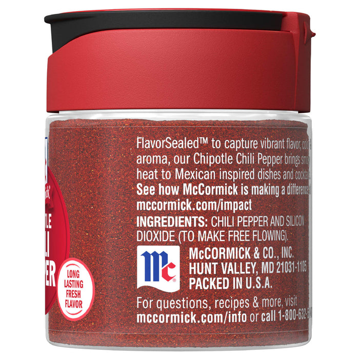 A McCormick Chipotle Chili Pepper spice jar with a red lid and a red label.