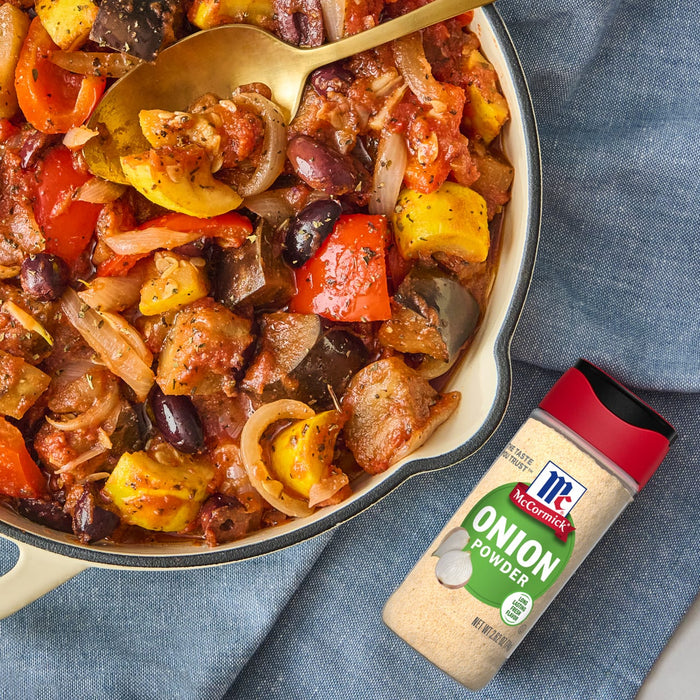 A bowl of McCormick Onion Powder with a side of eggplant and zucchini stew.