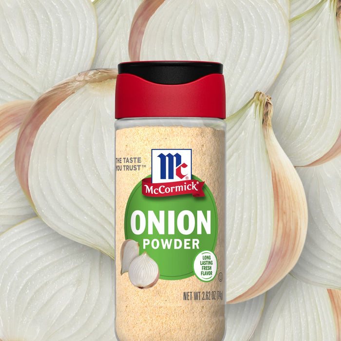 A jar of McCormick Onion Powder sits in front of a pile of onion slices.