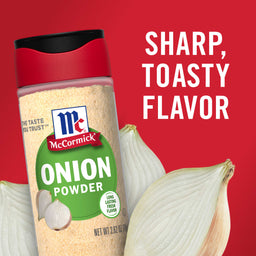 A container of McCormick Onion Powder with a white onion in the background.