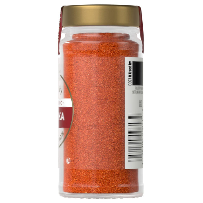 A jar of McCormick Paprika is shown, highlighting the product's color and packaging.