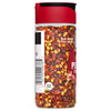 A bottle of McCormick Crushed Red Pepper.
