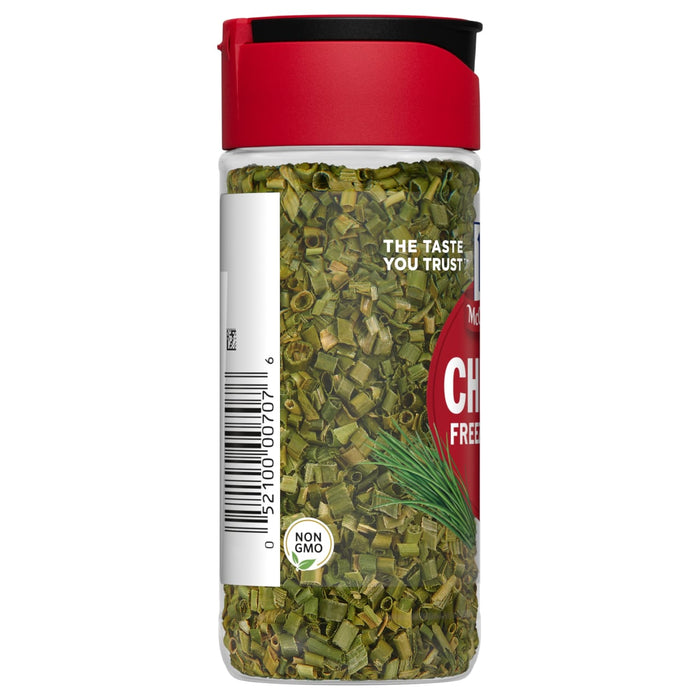 A jar of McCormick Chives, a dried herb, with a red lid and a non-GMO label.