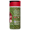A bottle of McCormick Parsley Flakes.