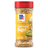 A clear plastic bottle of Mccormick Everything Bagel Seasoning Assorted Form 4.8 Oz featuring a red flip-top lid and a yellow label with a serving suggestion of avocado toast.
