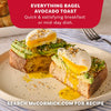 A delicious breakfast of everything bagel avocado toast topped with poached eggs and a generous sprinkle of Mccormick Everything Bagel Seasoning Assorted Form 4.8 Oz.