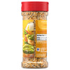 A side view of a clear bottle of Mccormick Everything Bagel Seasoning Assorted Form 4.8 Oz, showing the nutrition facts, ingredients, and a serving suggestion of the seasoning on avocado toast.