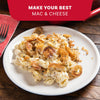 A plate of creamy macaroni and cheese is topped with crispy fried onions and a generous sprinkle of Mccormick Everything Bagel Seasoning Assorted Form 4.8 Oz.