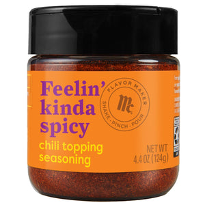 A jar of McCormick Feelin' Kinda Spicy chili topping seasoning.