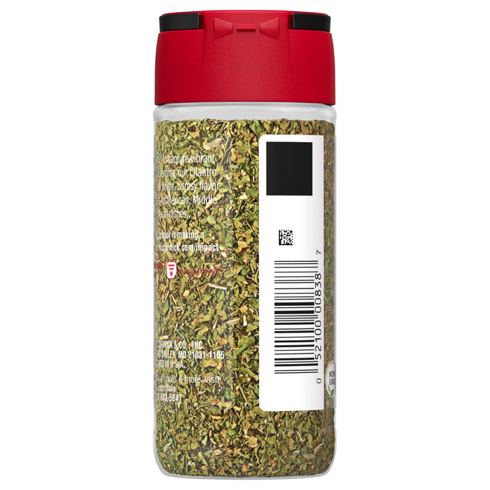 A glass jar of McCormick Cilantro.