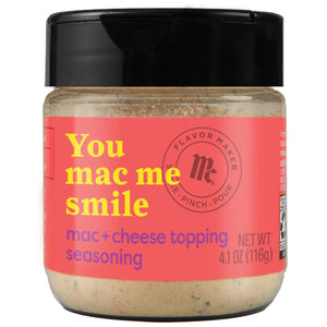 A jar of McCormick Flavor Maker You Mac Me Smile mac+cheese topping seasoning.