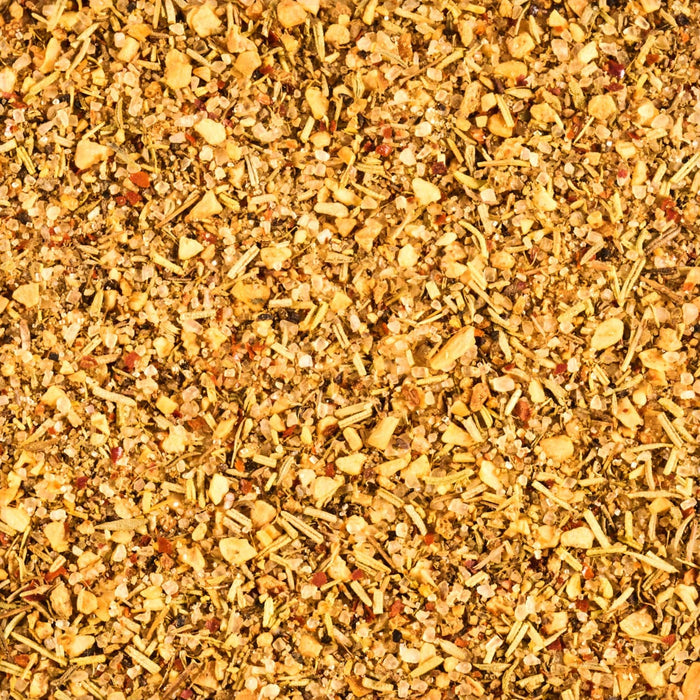 A close-up shot reveals a mixture of dried herbs and spices, showcasing a blend of textures and colors.