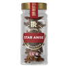 A clear glass jar of Mccormick Gourmet, 0.42 Oz, is filled with whole star anise pods and shown against a white background.