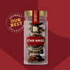 A clear glass jar of Mccormick Gourmet, 0.42 Oz whole star anise is shown against a rich red background, highlighting the Our Best Collection branding.