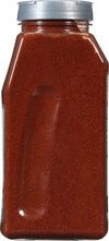 A glass jar of red chili powder.