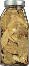 A glass jar filled with dried bay leaves.