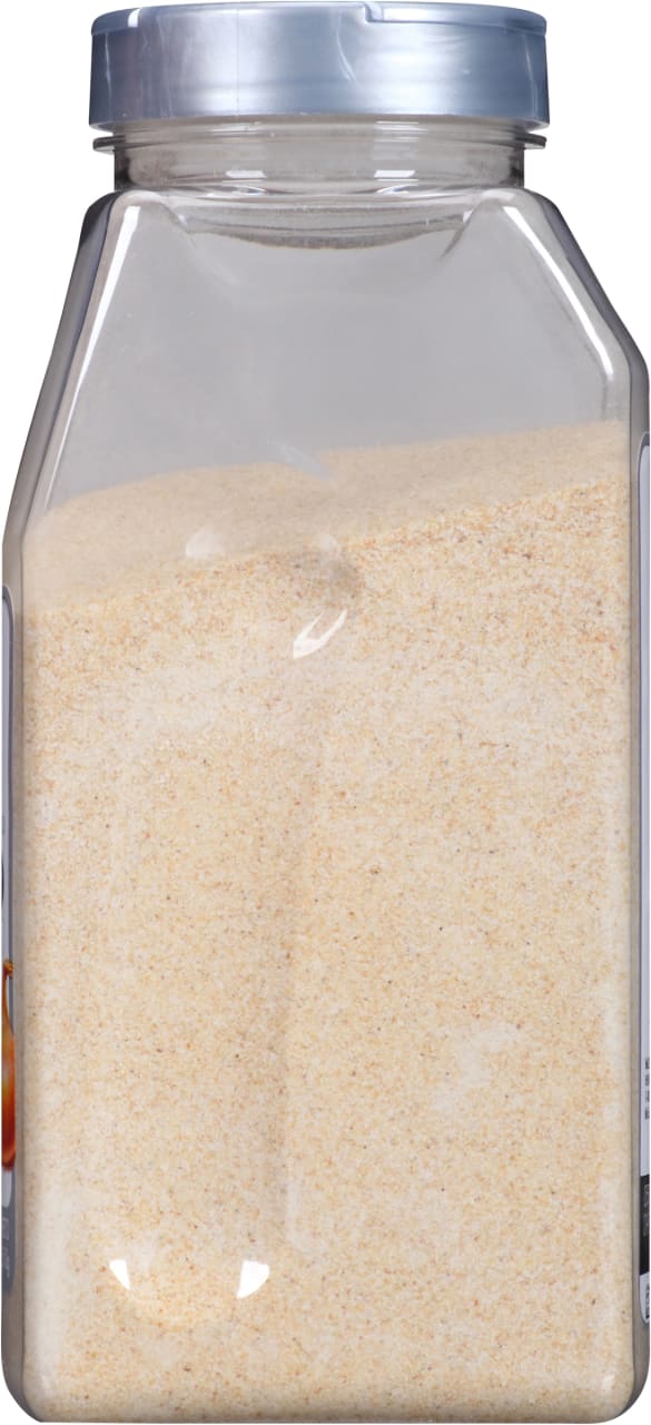 A clear plastic jar filled with granulated garlic.