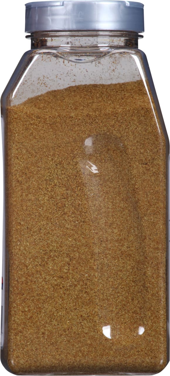 A clear plastic jar filled with a brown spice.