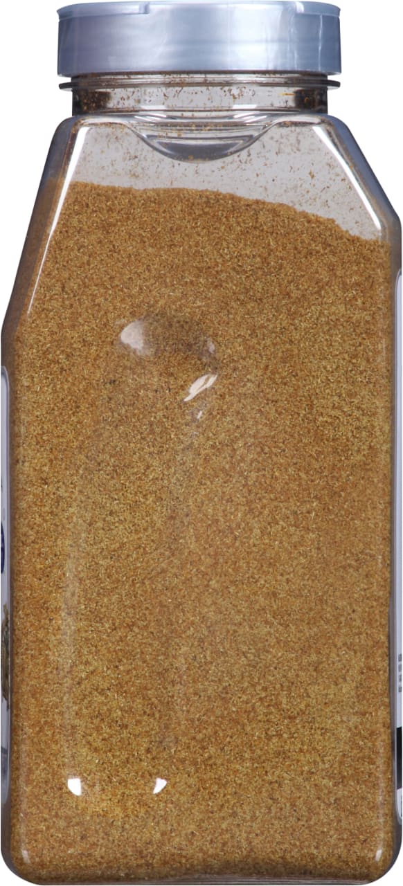 A clear plastic jar filled with a brown spice.