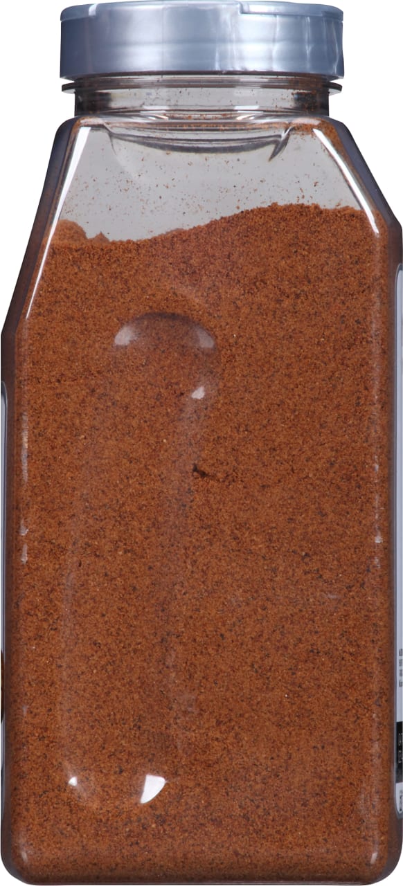 A plastic jar of McCormick Grill Mates Montreal Steak Seasoning.