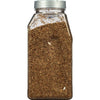 A clear plastic jar filled with dried oregano.