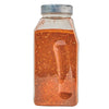 A clear plastic jar filled with a red and orange spice blend.