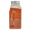 A clear plastic bottle filled with a red and orange spice blend.