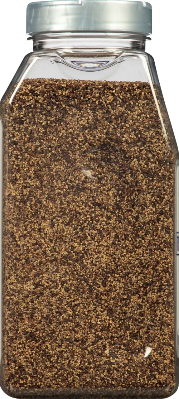 A clear plastic jar filled with black peppercorns.