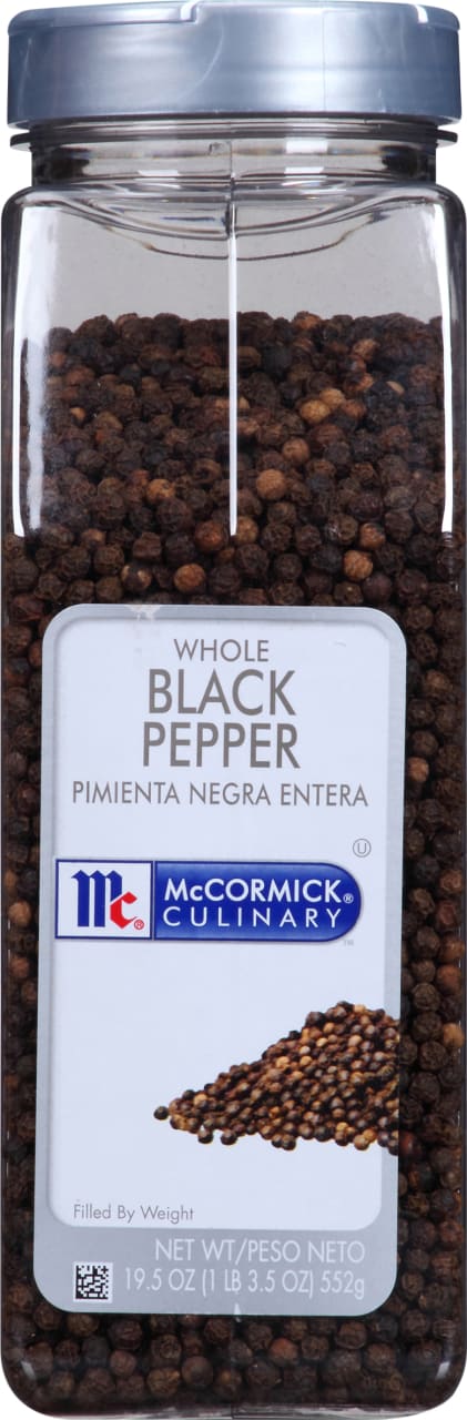 A container of McCormick Culinary Whole Black Pepper.
