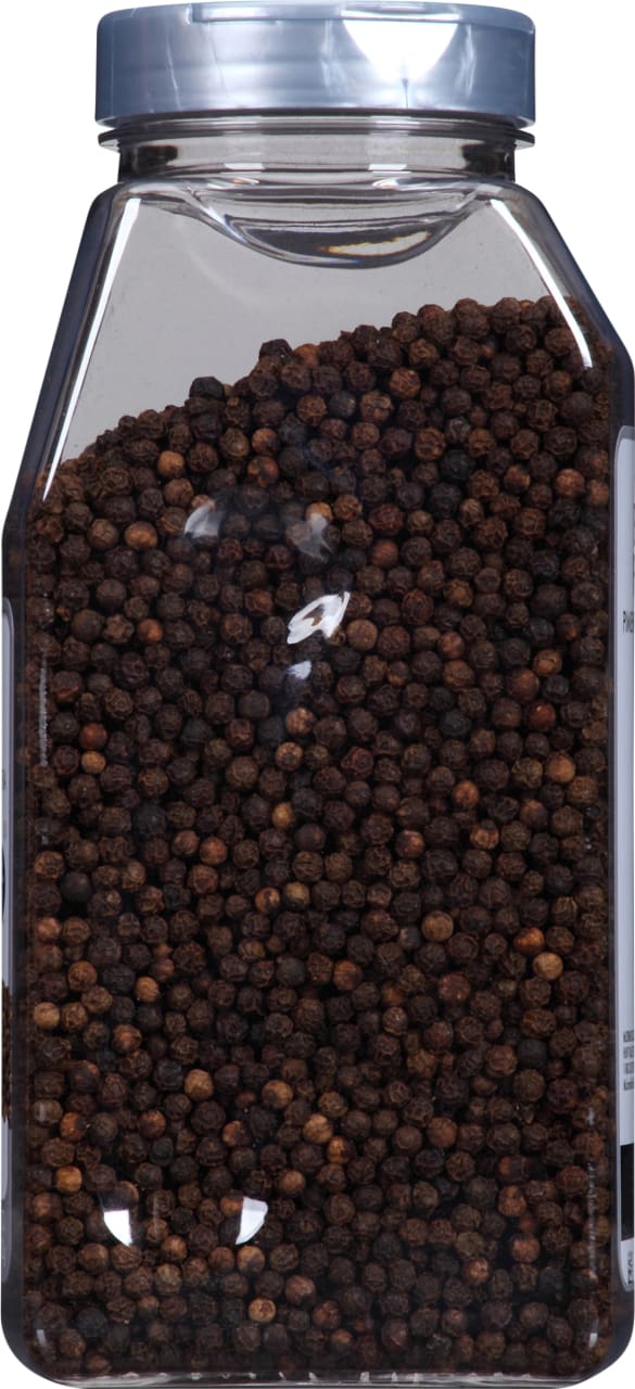 A clear plastic jar filled with black peppercorns.