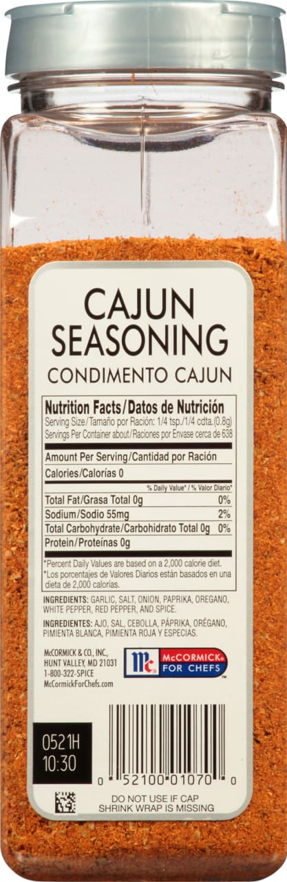 A McCormick for Chefs Cajun Seasoning bottle with nutrition facts and ingredients.