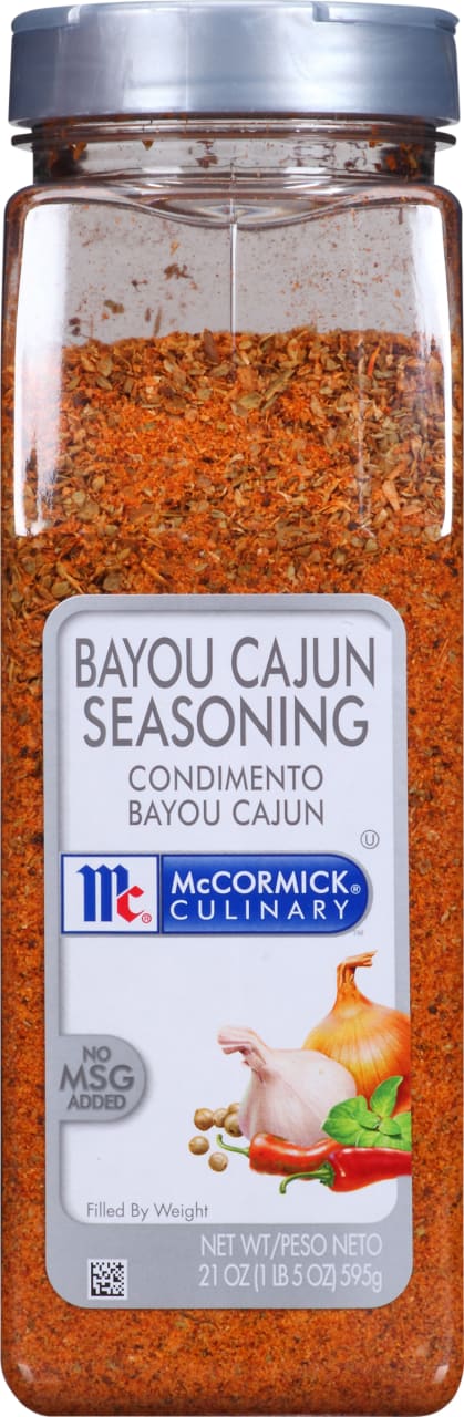 A McCormick Culinary Bayou Cajun Seasoning bottle with a red and orange spice blend.