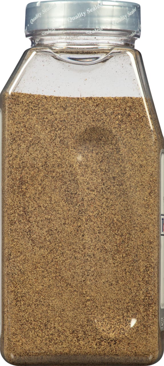 A clear plastic jar filled with ground black pepper.