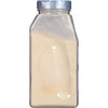 A clear plastic jar with a silver lid filled with a light yellow powder.