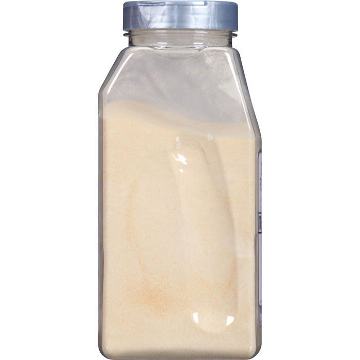 A clear plastic jar with a silver lid filled with a light yellow powder.