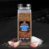 A container of McCormick Montreal Steak Spice is displayed with garlic, peppercorns, and salt.