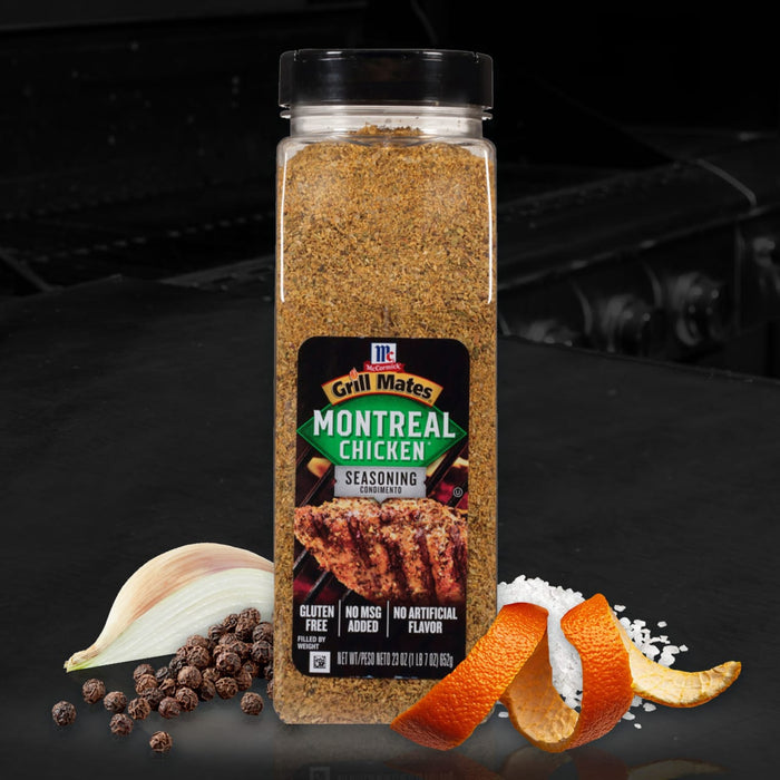 A jar of McCormick Grill Mates Montreal Chicken Seasoning with a garlic clove, black peppercorns, orange peel, and salt.