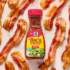 A jar of McCormick Bac'n Pieces Bacon Flavored Bits is surrounded by crispy cooked bacon.