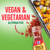 A jar of McCormick Bac'n Pieces with a red arrow pointing to it, and a baking sheet with roasted vegetables in the background.